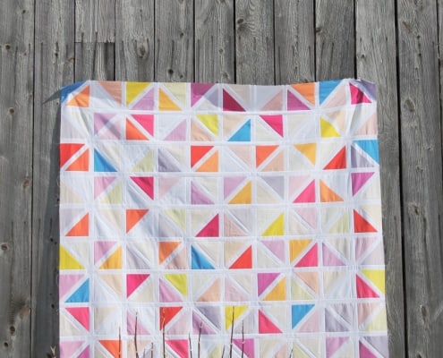 An image of a quilt made with a pattern of two triangle blocks